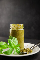 Pesto sauce basil, olive oil, parmesan, pine nuts, garlic natural product tasty snack fresh delicious gourmet food background on the table rustic top view copy space