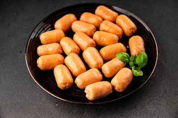 Sausage mini meat portion size fast food natural product tasty snack fresh delicious gourmet food background on table rustic top view copy space