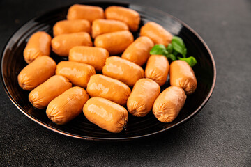 Sausage mini meat portion size fast food natural product tasty snack fresh delicious gourmet food background on table rustic top view copy space