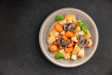 Potato stew mushrooms and vegetables natural tasty snack fresh delicious gourmet food background on the table rustic top view copy space keto and paleo diet vegerian and vegan food