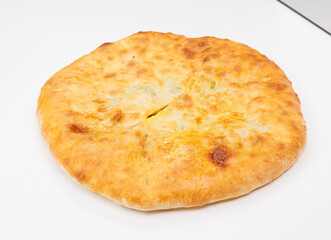 Golden Baked Georgian Kubdari With Flaky Crust And Meat Filling On White Plate