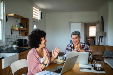Couple working from home on their laptops