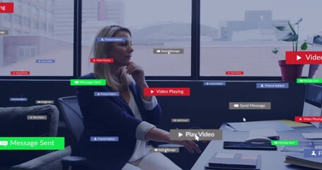 Mature woman at business desk, noticing play icon near hand tapping midair controls managing popups - Powered by Adobe
