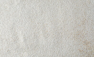 Pile of integral barley flour background and texture, top view