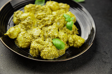 Gnocchi pesto sauce green tasty snack fresh gourmet food background on the table rustic top view copy space vegerian and vegan food