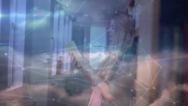 Teenage girl pulling paperback and skimming education while glowing network overlay forming clouds