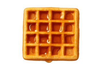 Golden waffle with maple syrup dripping, top view