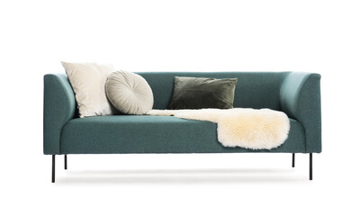 Soft sofa with pillows and faux fur isolated on white