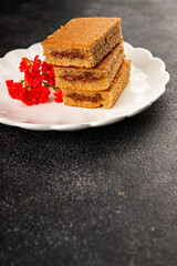 Biscuit cake portion filling jam sweet dessert cake natural product tasty snack fresh delicious gourmet food background on the table rustic top view copy space