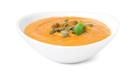 Delicious pumpkin soup with seeds and basil in bowl isolated on white