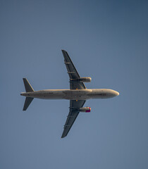 flying airplane on a clear sunny day