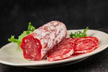 Dry sausage slice pork less fat jamon cured meat natural product tasty snack fresh delicious gourmet food background on the table rustic top view copy space