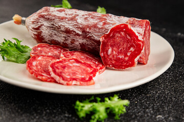 Dry sausage slice pork less fat jamon cured meat natural product tasty snack fresh delicious gourmet food background on the table rustic top view copy space