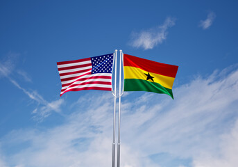 flags of  Ghana and United States of America over blue sky background.