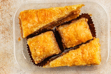 Baklava with pistachios and almonds dessert oriental sweets natural product tasty snack fresh delicious gourmet food background on the table rustic top view copy space