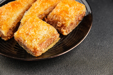 Baklava with pistachios and almonds dessert oriental sweets natural product tasty snack fresh delicious gourmet food background on the table rustic top view copy space