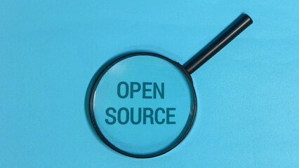 Open Source Concept Magnifying Glass Focus on Technology and Development