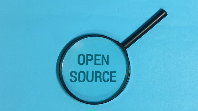 Open Source Concept Magnifying Glass Focus on Technology and Development - Powered by Adobe