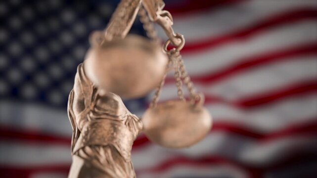 360 Degrees Rotating Seamless Looping Lady Justice Statue Over A Slow Motion American Flag Background.