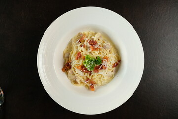 Delicious pasta dish with tomato, herbs and cheese