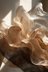Flowing fabrics of light and shadow, layered in elegant, soft curves