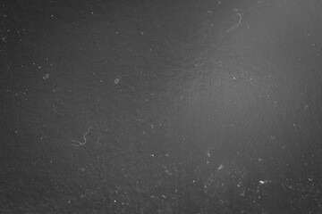 Abstract monochrome texture. Dusty gradient macro texture. Dark background. Selective focus