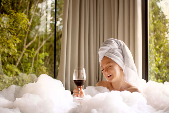woman taking bubble bath, relaxing moment in hot tub