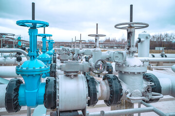 Industrial area. Industrial valve instalation in petrochemical area. Valves with electrical control.