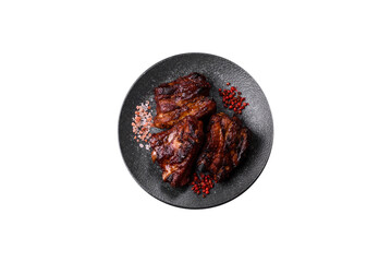Grilled or barbecued pork ribs with sauce. Grilled ribs