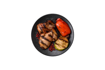 Chicken breast cooked on a grill or barbecue with sauce. Grilled chicken