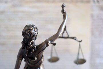 The statue of justice Themis or Justitia, the blindfolded goddess of justice against US...