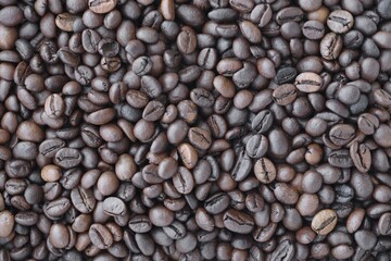 Coffee beans dark background, food ingredient photo close up