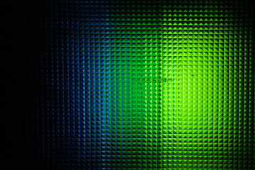 Abstract geometric texture with a vibrant gradient of blue, green, red, pink, yellow and white.  futuristic background design.

