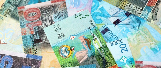 Kuwaiti dinar currency money bills. The current banknotes lies on table in big amount close up