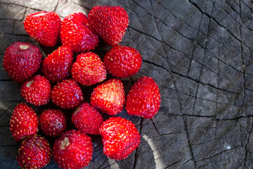 red strawberries on a wooden board