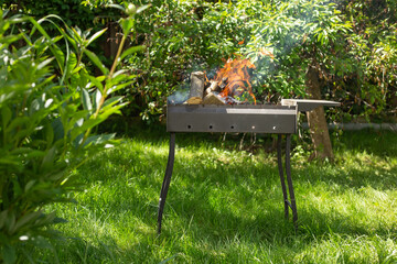 burning barbecue in the garden