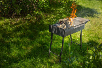 firewood in a brazier with fire