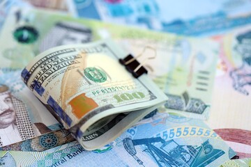 Bahraini dinar currency money bills and bunch of us dollar banknotes close up. The concept of economics and currency exchange