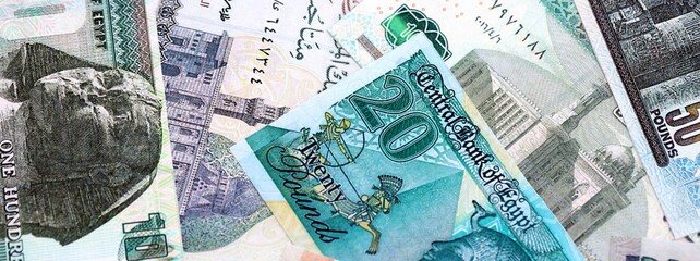 Egyptian pound currency money bills. The current banknotes lies on table in big amount close up