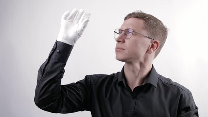 Expert jeweler men removes natural rough diamond from bag to evaluate flaws and inclusions, evaluates gemstone for cutting on manufacturing factory.