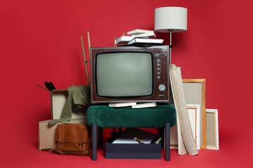 Garage sale. Different used stuff on red background