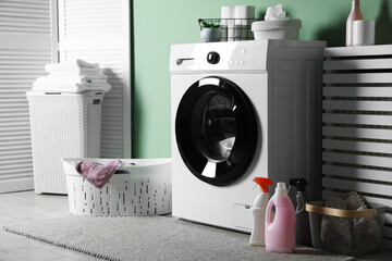 Laundry room with modern washing machine. Interior design