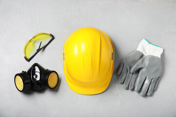 Different safety equipment on light grey background, flat lay