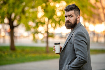 Man drinking morning coffee. Coffee break. Everyday style routine. Bearded man having coffee in...