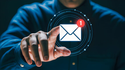 Digital Communication: A modern businessman is pointing to a digital email icon, showing the essence of contemporary digital communication.