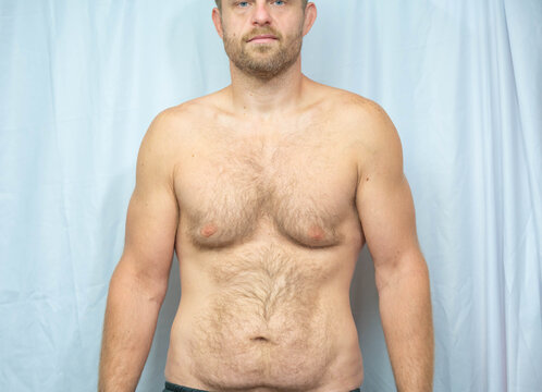 Studio shot of white male after weight lose, fit man average build, handsome, hairy chest isolated background image, macho, manly, muscularity 