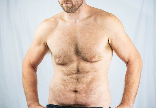 Studio shot of white male after weight lose, fit man average build, handsome, hairy chest isolated background image, macho, manly, muscularity 