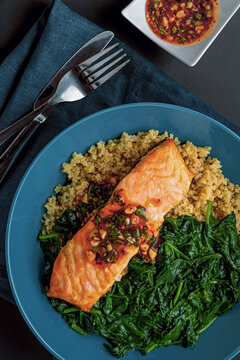 Grilled Salmon Fillet Served with Quinoa and Spinach. Top View Shot Above.