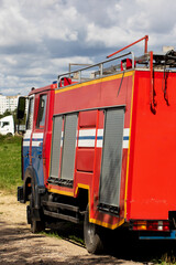 A Red and Blue Fire Truck positioned on Location for service calls