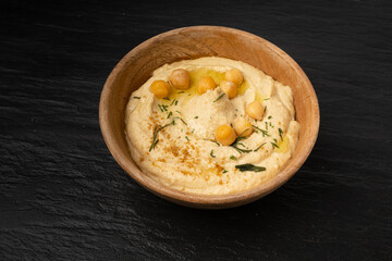Hummus in bowl, houmous dip, chickpea humus tahini sauce, middle eastern spread